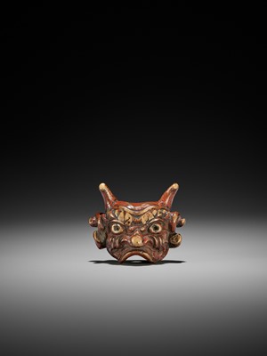 Lot 254 - AN UNUSUAL LACQUERED WOOD MASK NETSUKE OF AN ONI