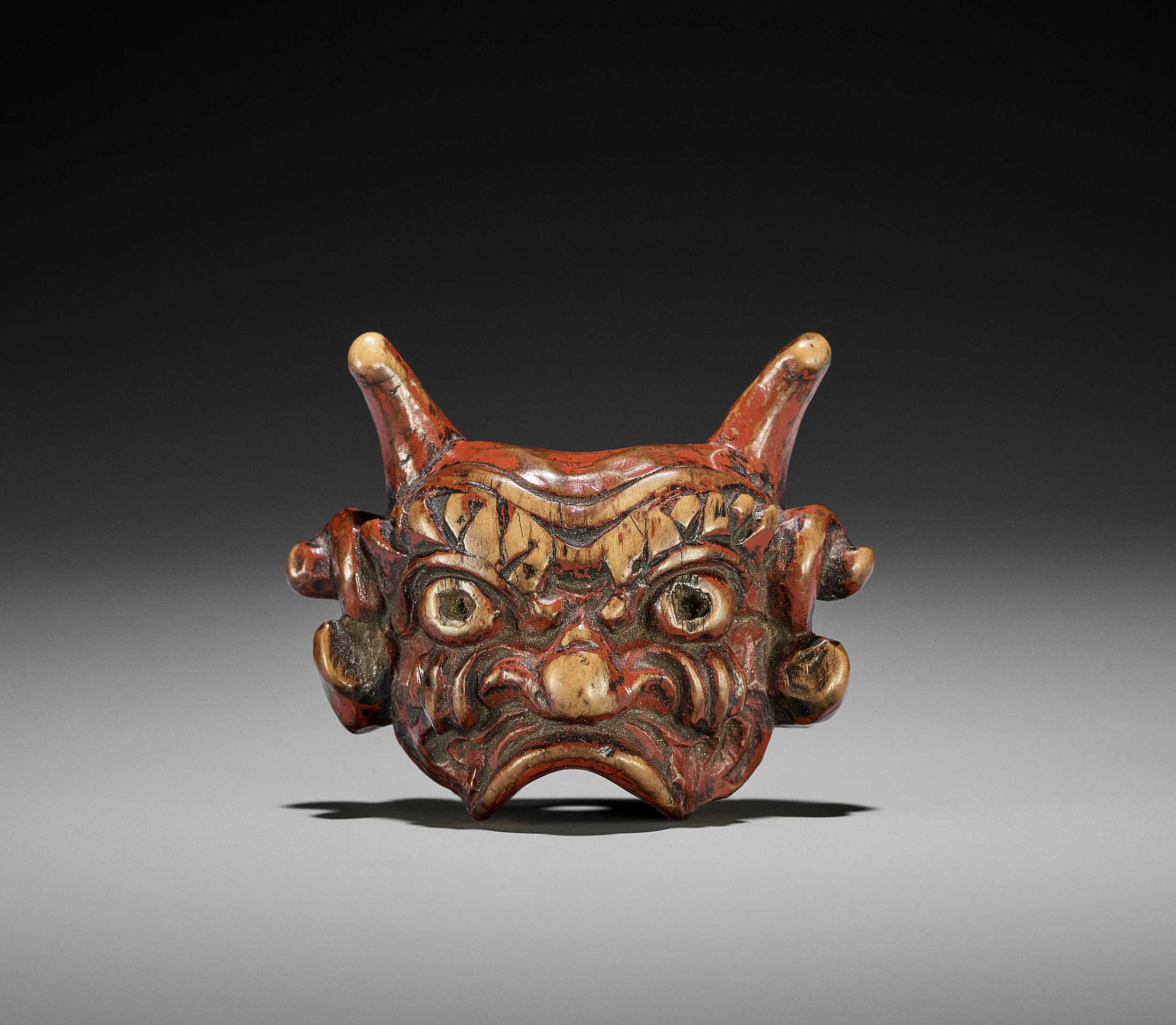 Lot 254 An Unusual Lacquered Wood Mask Netsuke Of An