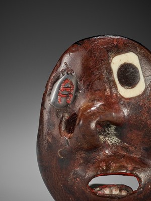 Lot 86 - AN UNUSUAL LACQUERED WOOD REVERSIBLE MASK NETSUKE OF A MONSTROUS HEAD