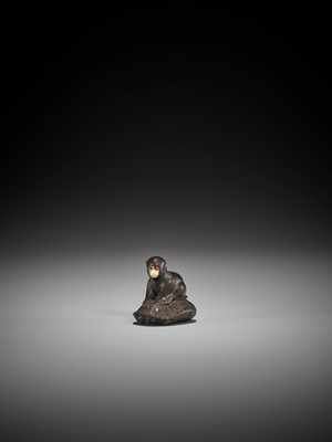 Lot 212 - SO: A FINE AND CHARMING TOKYO SCHOOL WOOD NETSUKE OF A MONKEY SEATED ON A MINOGAME