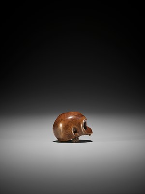 Lot 129 - A FINE WOOD NETSUKE OF A SKULL WITH BAMBOO SHOOT
