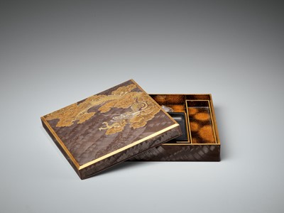 Lot 106 - A SUPERB ZESHIN-STYLE INLAID LACQUER SUZURIBAKO WITH DRAGON AMONGST CLOUDS AND COMBED WAVES