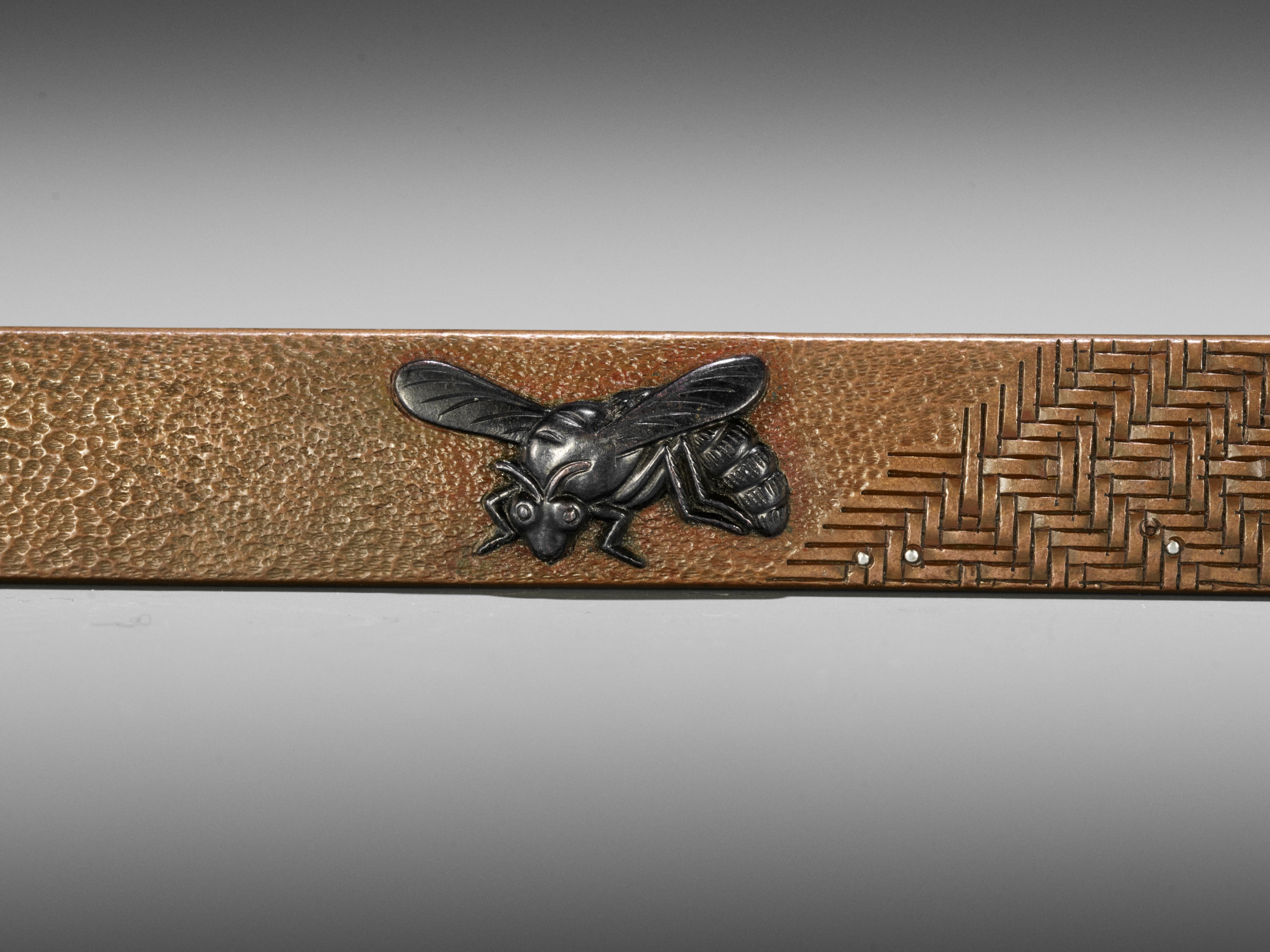 Lot 49 - A SILVER AND SHAKUDO-INLAID COPPER KOZUKA