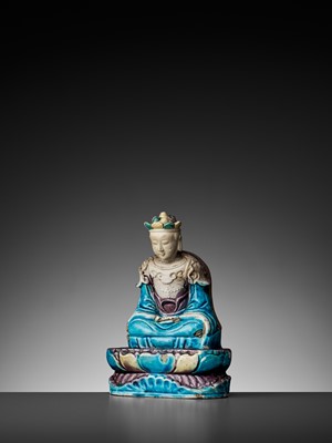 Lot 192 - A FAHUA-DECORATED BISCUIT FIGURE OF KSITIGARBHA, LATE MING DYNASTY