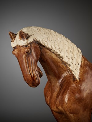 Lot 694 - AN AMBER-GLAZED POTTERY HORSE WITH WHITE-GLAZED BRAIDED MANE AND TAIL