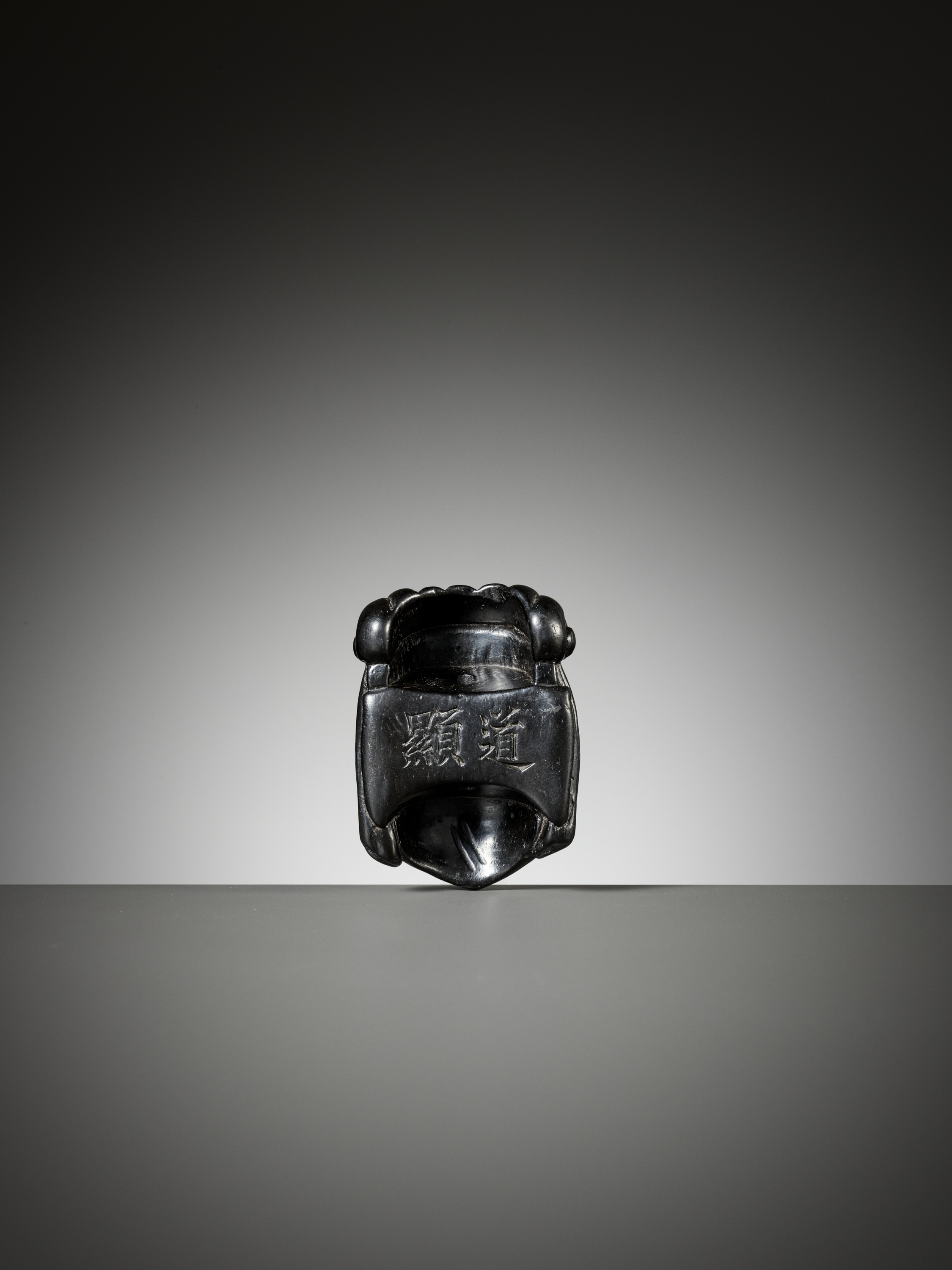 Lot 289 - A RARE EBONY GYODO (RELIGIOUS) MASK NETSUKE