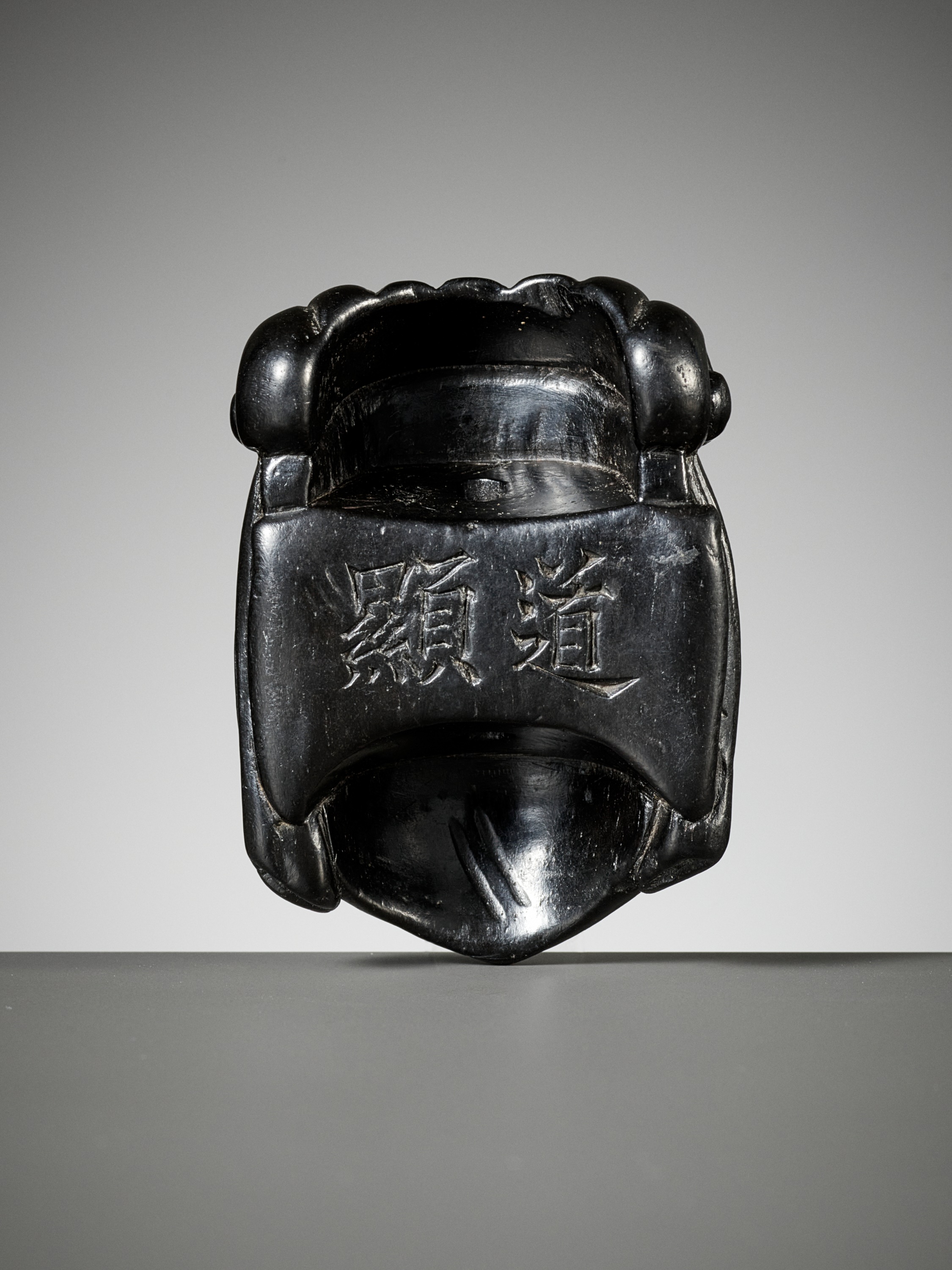 Lot 289 - A RARE EBONY GYODO (RELIGIOUS) MASK NETSUKE