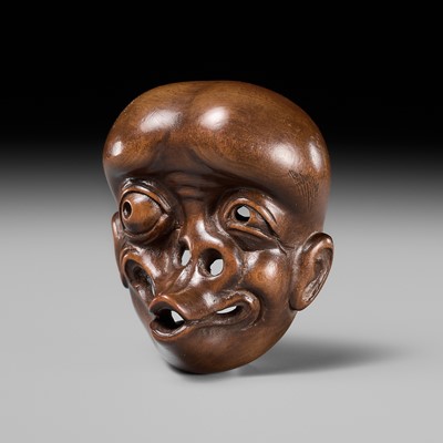 Lot 299 - A FINE WOOD MASK NETSUKE OF USOFUKI