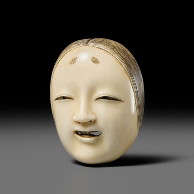 Lot 293 - SHOGETSU: AN IVORY MASK NETSUKE OF A NOH MASK, KO-OMOTE