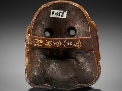 Lot 291 - KANO TESSAI: A LACQUERED WOOD MASK NETSUKE OF A KYOGEN MASK DEPICTING BUAKU