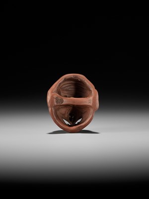 Lot 496 - SEKISEN: AN ONKO POTTERY MASK NETSUKE OF TOBI, KO-TENGU