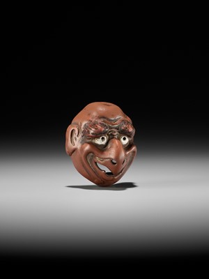 Lot 496 - SEKISEN: AN ONKO POTTERY MASK NETSUKE OF TOBI, KO-TENGU