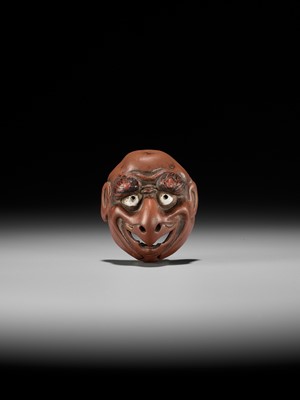 Lot 496 - SEKISEN: AN ONKO POTTERY MASK NETSUKE OF TOBI, KO-TENGU