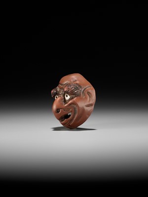Lot 496 - SEKISEN: AN ONKO POTTERY MASK NETSUKE OF TOBI, KO-TENGU