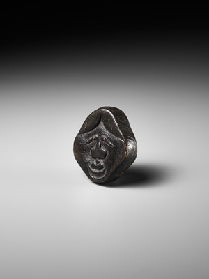 Lot 256 - AN UNUSUAL KIRI (PAULOWNIA) WOOD SHUNGA MASK NETSUKE OF FUKUWARAI TYPE