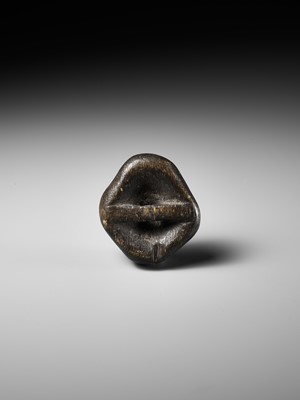 Lot 256 - AN UNUSUAL KIRI (PAULOWNIA) WOOD SHUNGA MASK NETSUKE OF FUKUWARAI TYPE