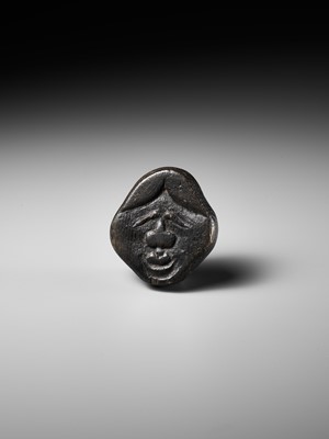 Lot 256 - AN UNUSUAL KIRI (PAULOWNIA) WOOD SHUNGA MASK NETSUKE OF FUKUWARAI TYPE