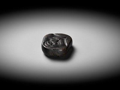 Lot 256 - AN UNUSUAL KIRI (PAULOWNIA) WOOD SHUNGA MASK NETSUKE OF FUKUWARAI TYPE
