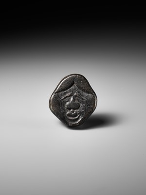 Lot 256 - AN UNUSUAL KIRI (PAULOWNIA) WOOD SHUNGA MASK NETSUKE OF FUKUWARAI TYPE