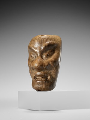 Lot 426 - YORIMITSU: A RARE AND UNUSUAL BAMBOO OMAI TYPE MASK NETSUKE