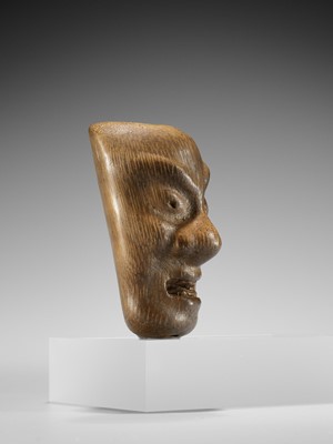 Lot 426 - YORIMITSU: A RARE AND UNUSUAL BAMBOO OMAI TYPE MASK NETSUKE