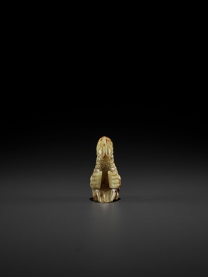 Lot 62 - A YELLOW AND RUSSET JADE FIGURE OF A PHOENIX, EASTERN ZHOU