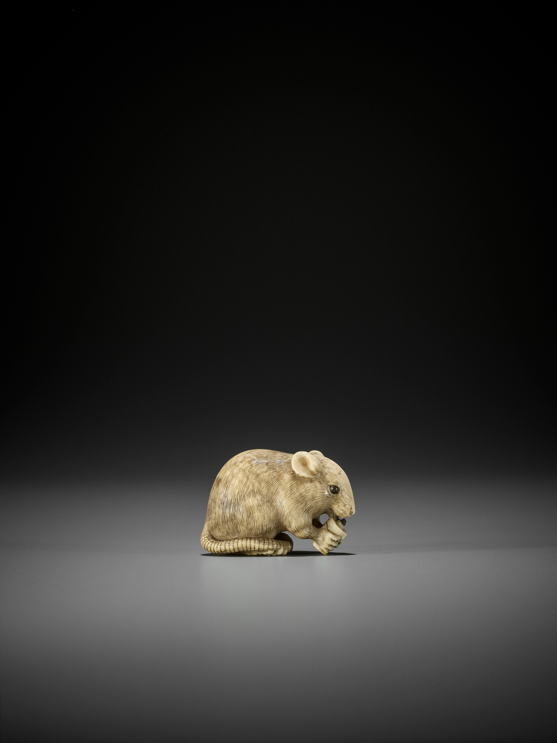 Lot 46 OKATORI A SUPERB IVORY NETSUKE OF A RAT
