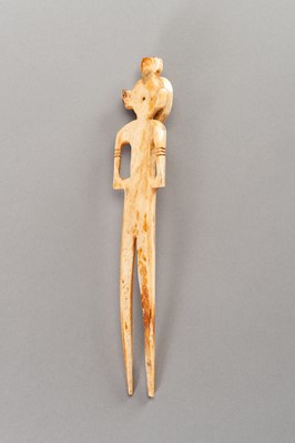 Lot 557 - A FIGURAL TRIBAL IVORY HAIRPIN