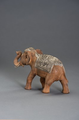 Lot 540 - A WOOD AND SILVERED METAL CAPARISONED ELEPHANT