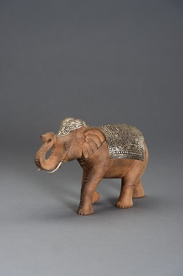 Lot 540 - A WOOD AND SILVERED METAL CAPARISONED ELEPHANT