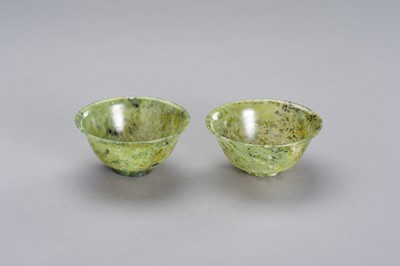 Lot 165 - A MOTTLED PAIR OF SPINACH GREEN JADE BOWLS