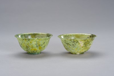 Lot 165 - A MOTTLED PAIR OF SPINACH GREEN JADE BOWLS