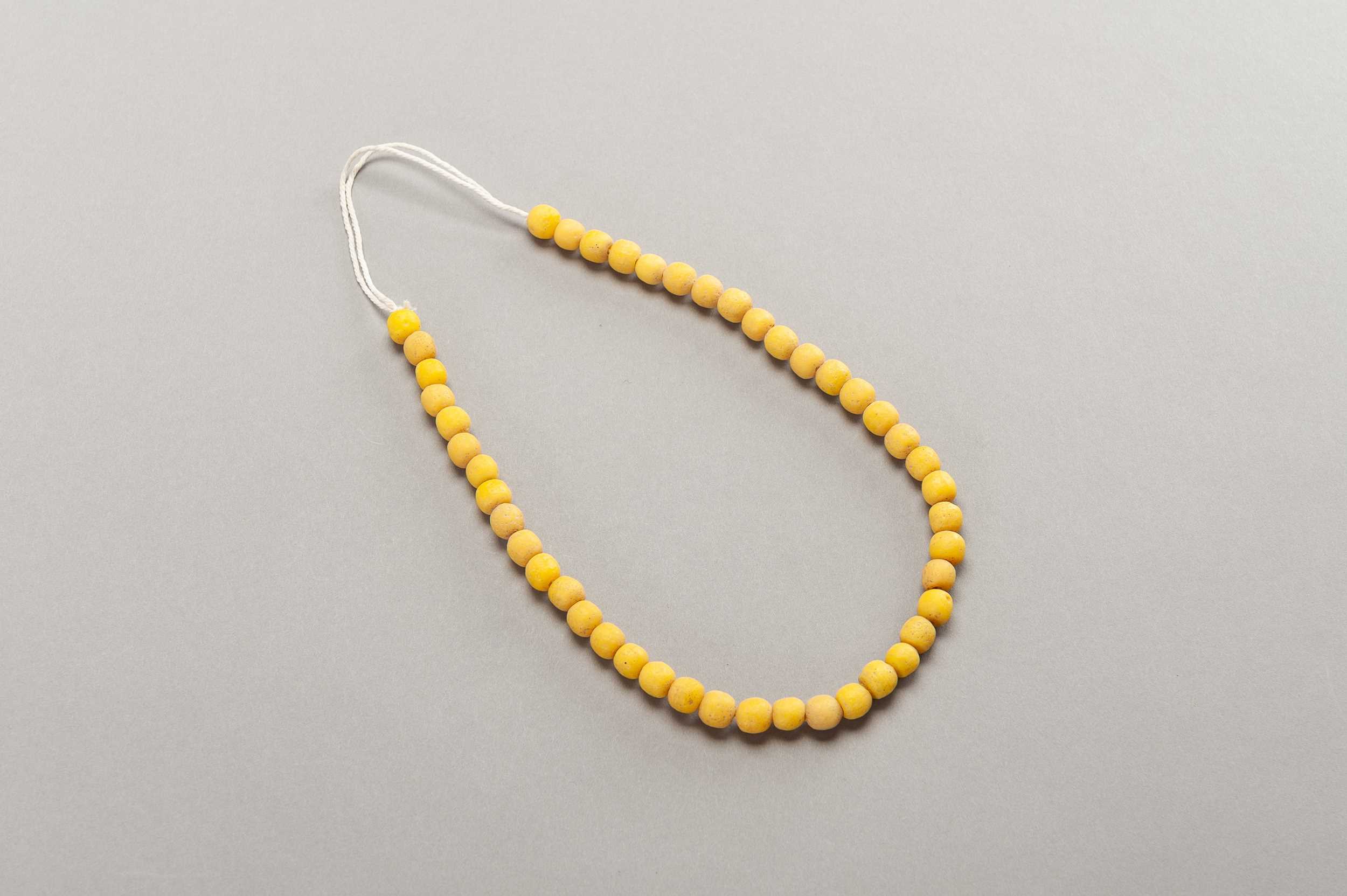 Lot 243 - 46 OLD YELLOW GLASS BEADS