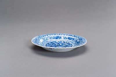 Lot 327 - A BLUE AND WHITE PORCELAIN ‘BIRD AND FLOWERS’ LOVED DISH, KANGXI