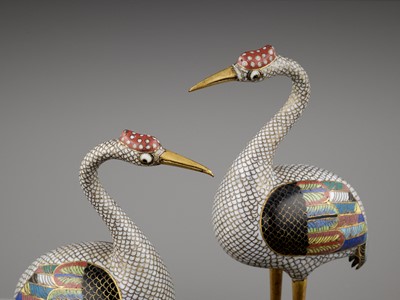 Lot 12 - A PAIR OF GILT BRONZE AND CLOISONNÉ ENAMEL FIGURES OF CRANES, QING DYNASTY