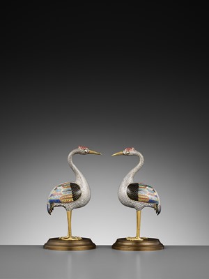 Lot 12 - A PAIR OF GILT BRONZE AND CLOISONNÉ ENAMEL FIGURES OF CRANES, QING DYNASTY