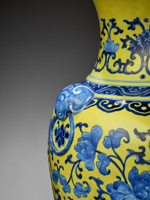 Lot 264 - A YELLOW-GROUND BLUE AND WHITE ‘AUSPICIOUS’ HU VASE, QING DYNASTY