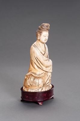 Lot 53 - A MING-STYLE IVORY FIGURE OF GUANYIN, QING DYNASTY