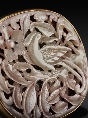 Lot 216 - A RETICULATED CELADON JADE ‘PHEASANT’ PLAQUE, MING DYNASTY