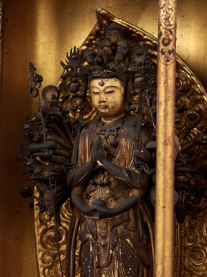 Lot 124 - A LACQUER ZUSHI (PORTABLE BUDDHIST SHRINE) WITH A GILT-WOOD FIGURE OF JUICHIMEN KANNON (THE 11-HEADED KANNON)