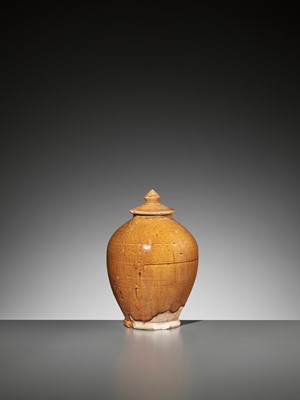 Lot 134 - AN AMBER-GLAZED POTTERY JAR AND COVER, TANG DYNASTY