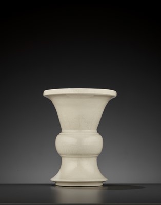 Lot 224 - A SOFT-PASTE ANHUA-INCISED BEAKER VASE, GU, MID-QING