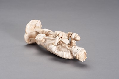 Lot 253 - AN IVORY AND BONE OKIMONO OF A TOY SELLER