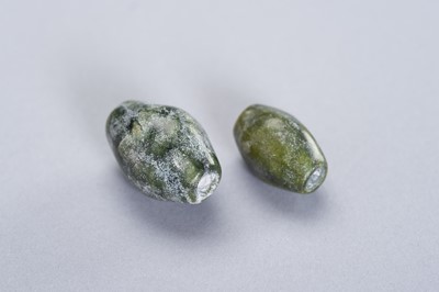 Lot 259 - TWO FINE JADE BEADS