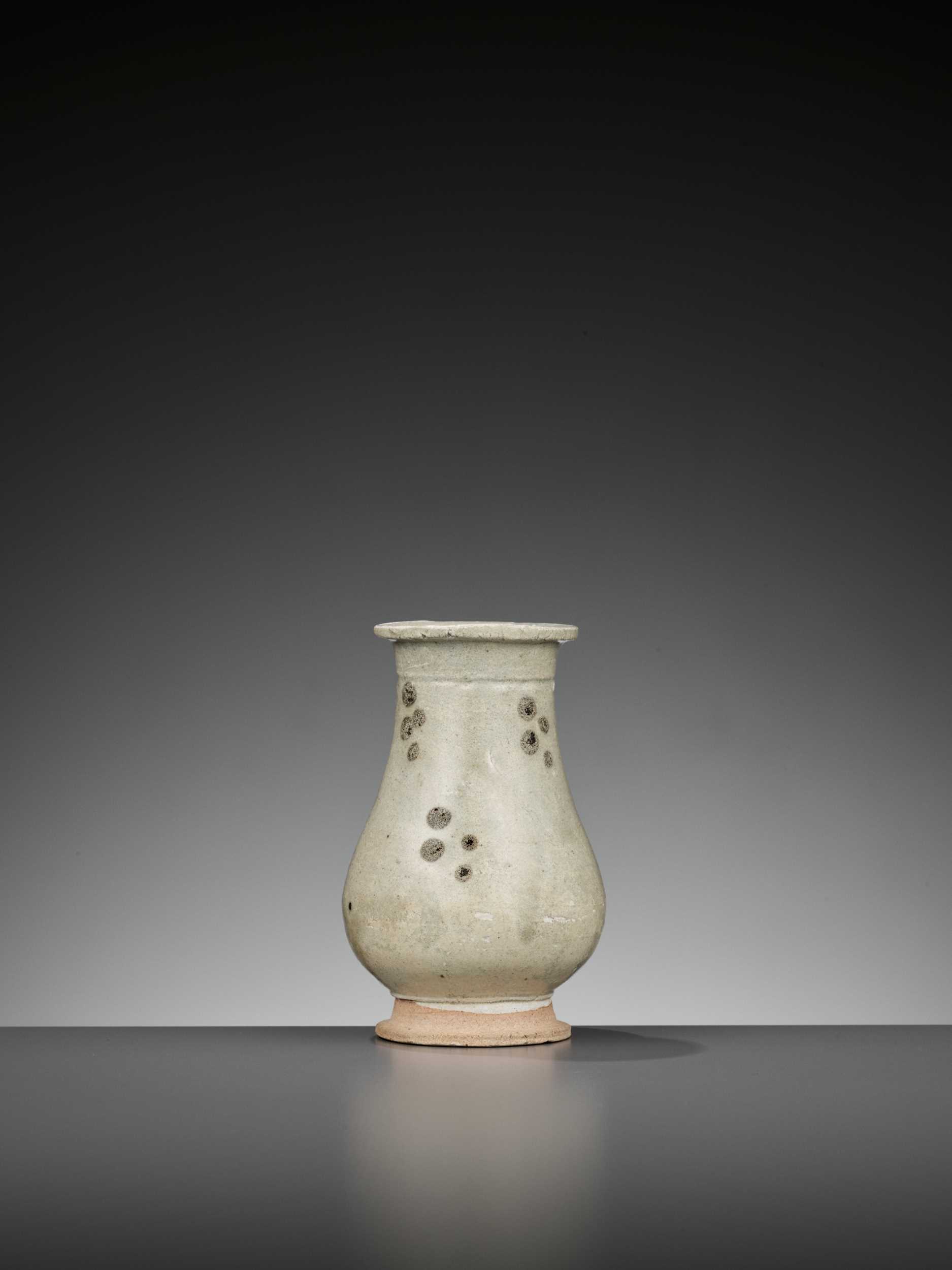 Lot 162 - A SMALL IRON-SPOTTED QINGBAI HU VASE, SONG TO YUAN DYNASTY
