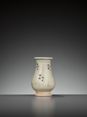 Lot 162 - A SMALL IRON-SPOTTED QINGBAI HU VASE, SONG TO YUAN DYNASTY