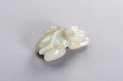 Lot 178 - A CELADON JADE ‘CAT AND BUTTERFLY’ PENDANT, LATE QING TO REPUBLIC