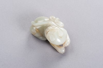 Lot 178 - A CELADON JADE ‘CAT AND BUTTERFLY’ PENDANT, LATE QING TO REPUBLIC