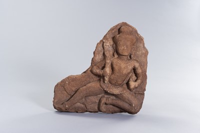Lot 1301 - A KHMER SANDSTONE RELIEF OF A DEITY