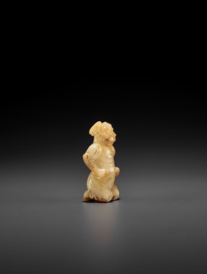 Lot 133 - A YELLOW AND RUSSET JADE FIGURE WITH A RAM’S HEAD